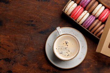 Coffee and colorful macaroons in gift box
