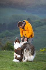 Happy dog and man playing outdoor