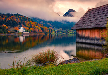Grundlsee lake in the morning mist. Fantastic sunrise in Brauhof village. Calm autumn scene of Austrian Alps, Styria, Europe. Beauty of nature concept background..