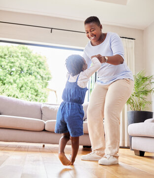 Mother, happy and dancing with child in living room, woman and toddler daughter for movement holding hands in apartment. Relationship, childhood and moving in lounge for music, weekend and smile