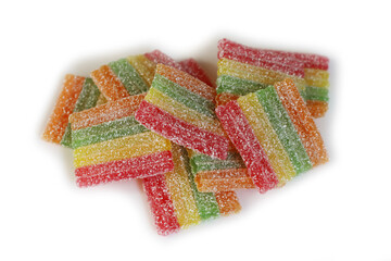 Many Rainbow gummy candies isolated on white background, Sour Jelly Candies Strips in Sugar...