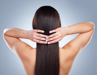Haircare, woman and back with hands on head for grooming, hygiene and wellness isolated in studio....