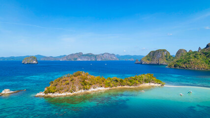 Aerail view of  tropical exotic island sand bar separating sea in two with turquoise  in El Nido,...