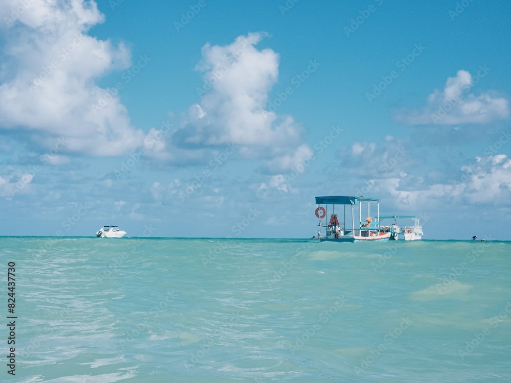 Wall mural boat on the sea