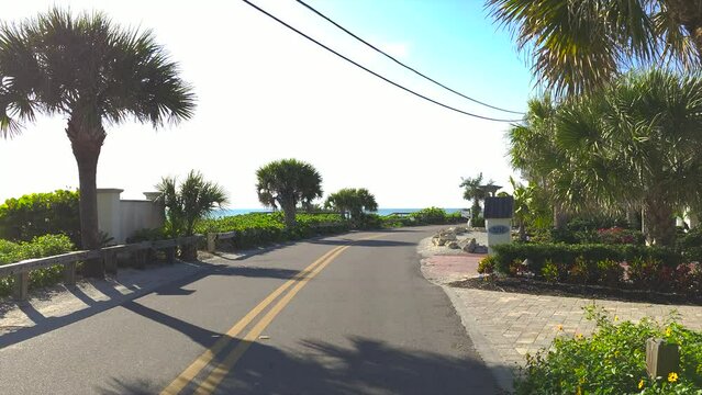 POV driving on Casey Key scenic road in sunny Florida.