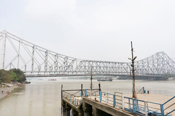 Howrah Bridge, spanning the Hoogli River in Kolkata, West Bengal, is an iconic engineering marvel and major landmark. Howrah Bridge, Kolkata, West Bengal, India