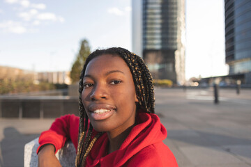 Smiling Young Woman Outdoors in Urban Setting