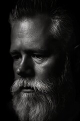 portrait of a middle aged man on black