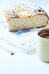 Simple yeast cake on bright background. Front view. Close up.