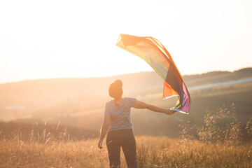 Young woman with LGBT flag.