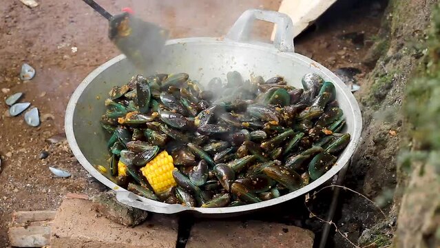 close up video, cooking green mussels. Perna viridis