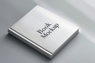 A book displaying the words book mockup on its cover, showcasing a design and advertising solution. Mockup for design