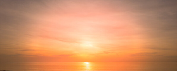 Enjoy a panoramic view of the skyline. The sun rises in the morning sky with colorful clouds. and beautiful cloud patterns In the soft light of the morning	