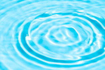 Natural background of water in summer. Blue surface. Clear water with ripples and splashes. water...