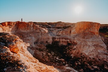 Man Standing on Mountain Cliff Red Rock Gorge Outback Western Australia Desert Kimberley Isolated © Lauren