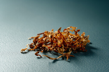 Dried cutted tobacco leaves. Textured abstract background.