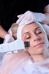 Face Skin Care. Close-up Of Woman Getting Facial Microdermabrasion Peeling Treatment At Cosmetic Beauty Spa Clinic. Exfoliation, Rejuvenation And Hydratation. Cosmetology.