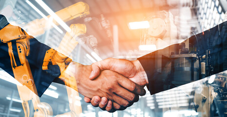 MLB Mechanized industry robot arm and business handshake double exposure. Concept of successful...