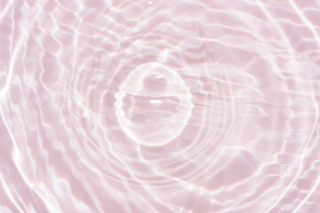 Pink water bubbles on the surface ripple. Defocus blurred transparent purple colored clear calm...