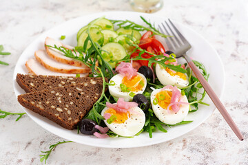Healthy breakfast. Boiled egg, chicken ham, bread and fresh salad. Keto breakfast.