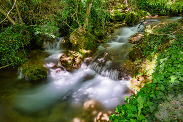 Veliki Buk in Lisine, Serbia. Cascade falls over mossy rocks 