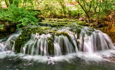 Veliki Buk in Lisine, Serbia. Cascade falls over mossy rocks 