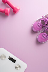 Fitness equipment including pink dumbbells, sneakers, and a scale on a pink vertical background, representing weight loss and exercise
