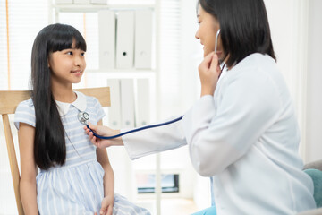 Fototapeta premium doctor in a white coat conducting a health check on a girl, father by her side.
