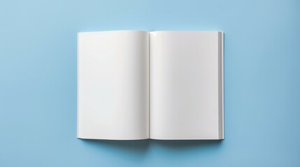 Mock-up of Blank White Book on a Blue Background - Opened Centerfold Display