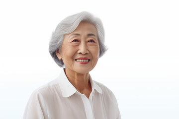 Smiling senior asian woman on white background. Topics related to old age. Asia. China. Japan. Retirement home. Grandmothers day . Retirement. Image for Graphic Designer. Senior residence. AI.