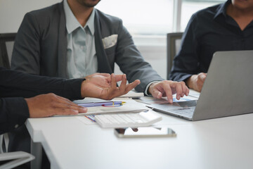 Business idea. Business people talking And calculations about charts and graphs showing the growth of investment results Of successful teamwork