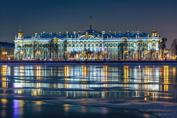 Winter Palace in Saint Petersburg illuminated at night, reflecting in the Neva River