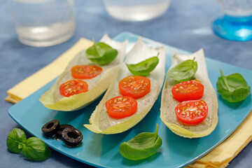 Endives with cheese cream and olives.