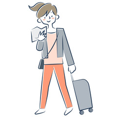 地図を見ながらキャリーケースをひいて歩く若い女性