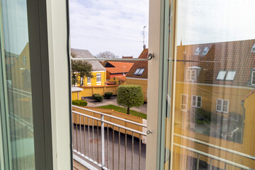 Open window overlooking the street on a summer day