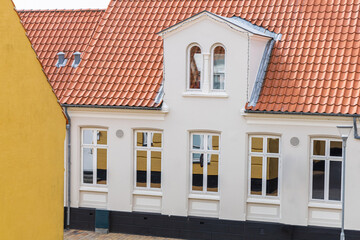 Beautiful old white house with tiled roof.