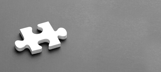 Puzzle piece with copy space on gray background