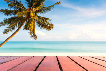 Empty wooden table, coconut tree on the beach. summer background for place product and advertising