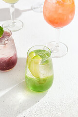 Refreshing Apple Lemonade and Mixed Fruit Drinks on White Background