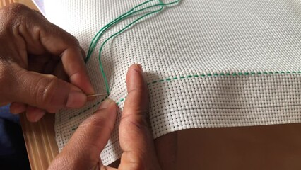 Cross stitch needle crafting on the aida fabric