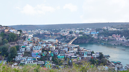 View of Mandhata Island and Omkareshwar Town, Omkareshwar, Madhya Pradesh, India.