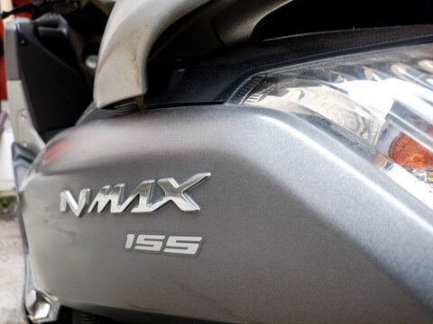 Nmax logo from Yamaha motorcycle products. Close up of chromium-plated metal logotype on the dark grey background.
Bandung-Indonesia,May 23 2024