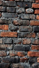 Naklejka premium Black brick wall texture. Brickwork background for design. Vertical brick surface
