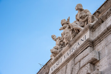 The Beautiful Sculptures above an entrance to the Vatican Museum in Vatican City, Rome, Italy