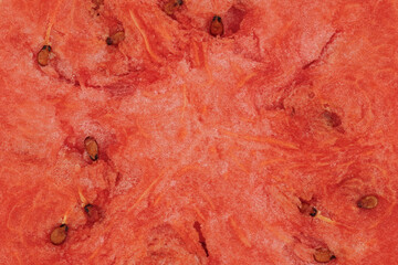 Summer fruit background concept, macro shot of a red watermelon slice texture