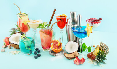 Summer colorful cocktails on blue background. Fresh tasty tropical drinks