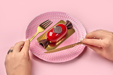 Artisanal candy-shaped mousse dessert on textured pink plate