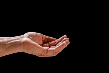 Elderly woman, wrinkled hand palm reaching out forward. Old lady arms. Old man hand on a black...