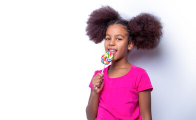 Funny african child with candy lollipop, happy little girl eating sugar lollipop. Girl afro,...