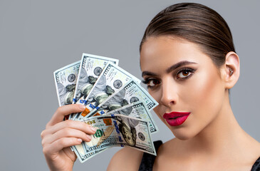 Woman holding lots of money in dollar currency. Luxury, beauty and money concept. Woman with...